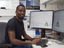 Researcher Dr. Felix Mulenge in front of a computer